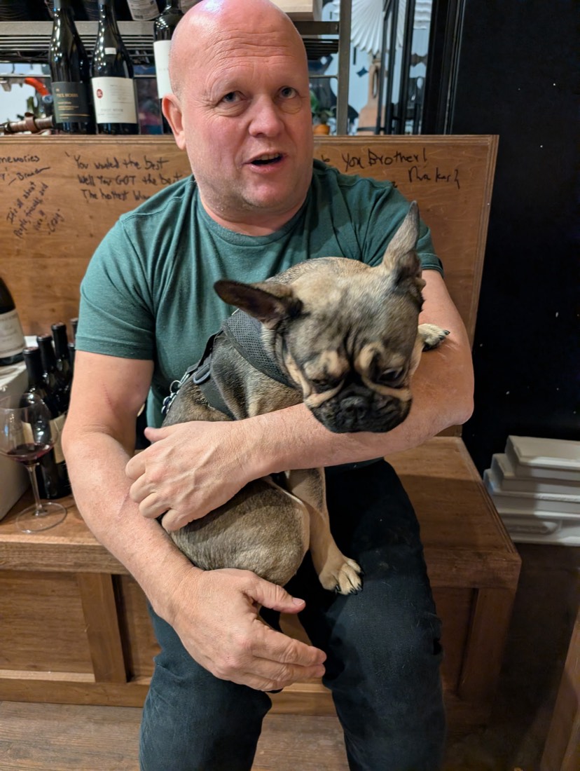 Gerry with his French bulldog at the shop