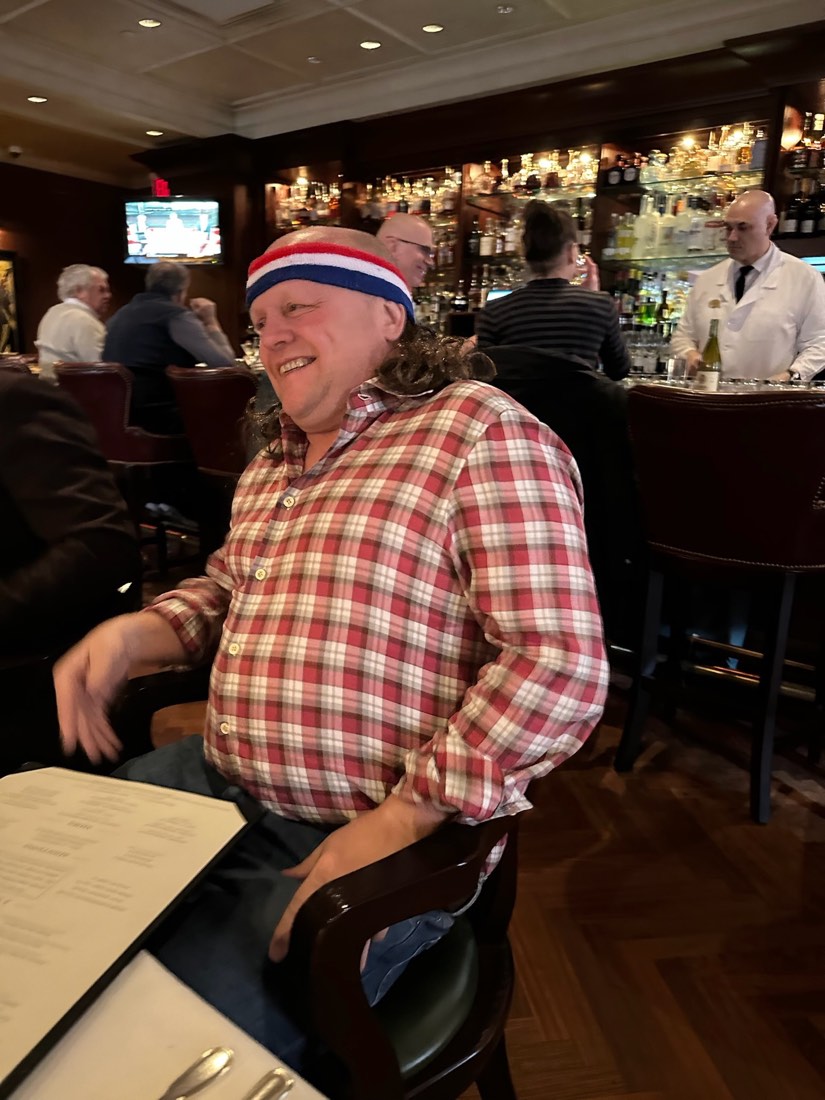 Gerry in a headband, mid-laugh